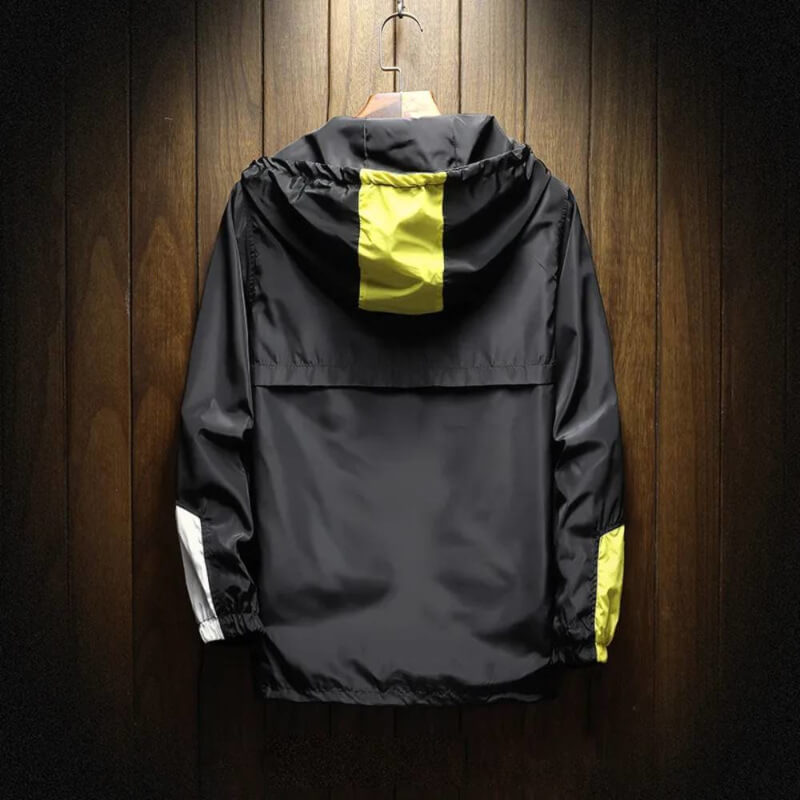Modern men's hooded half-zip windbreaker jacket. Features a distinctive color block design, perfect for men's fashion.