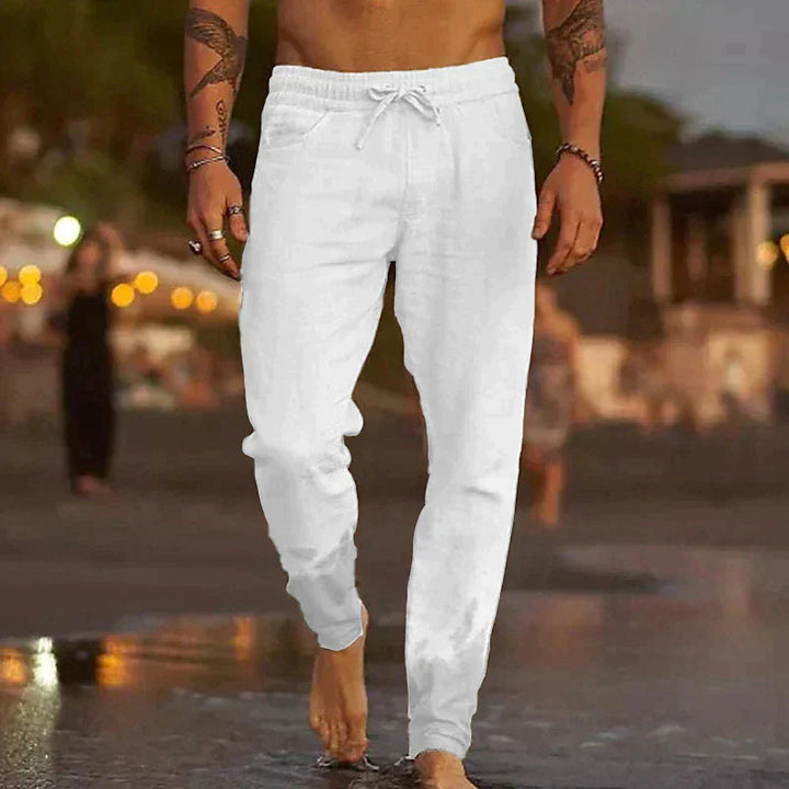 Relaxed fit men's athletic jogger pants with an adjustable drawstring, ideal for active lifestyles.