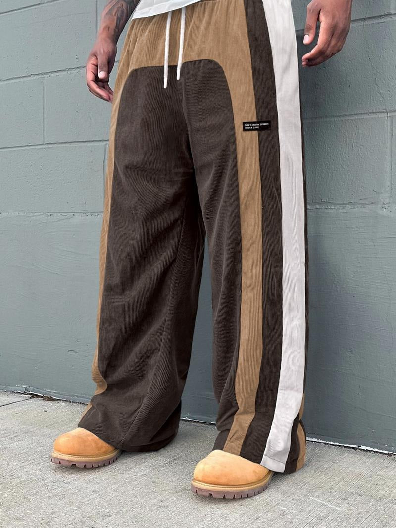 Full shot of men's casual corduroy pants, color-block design, perfect for a modern streetwear aesthetic.