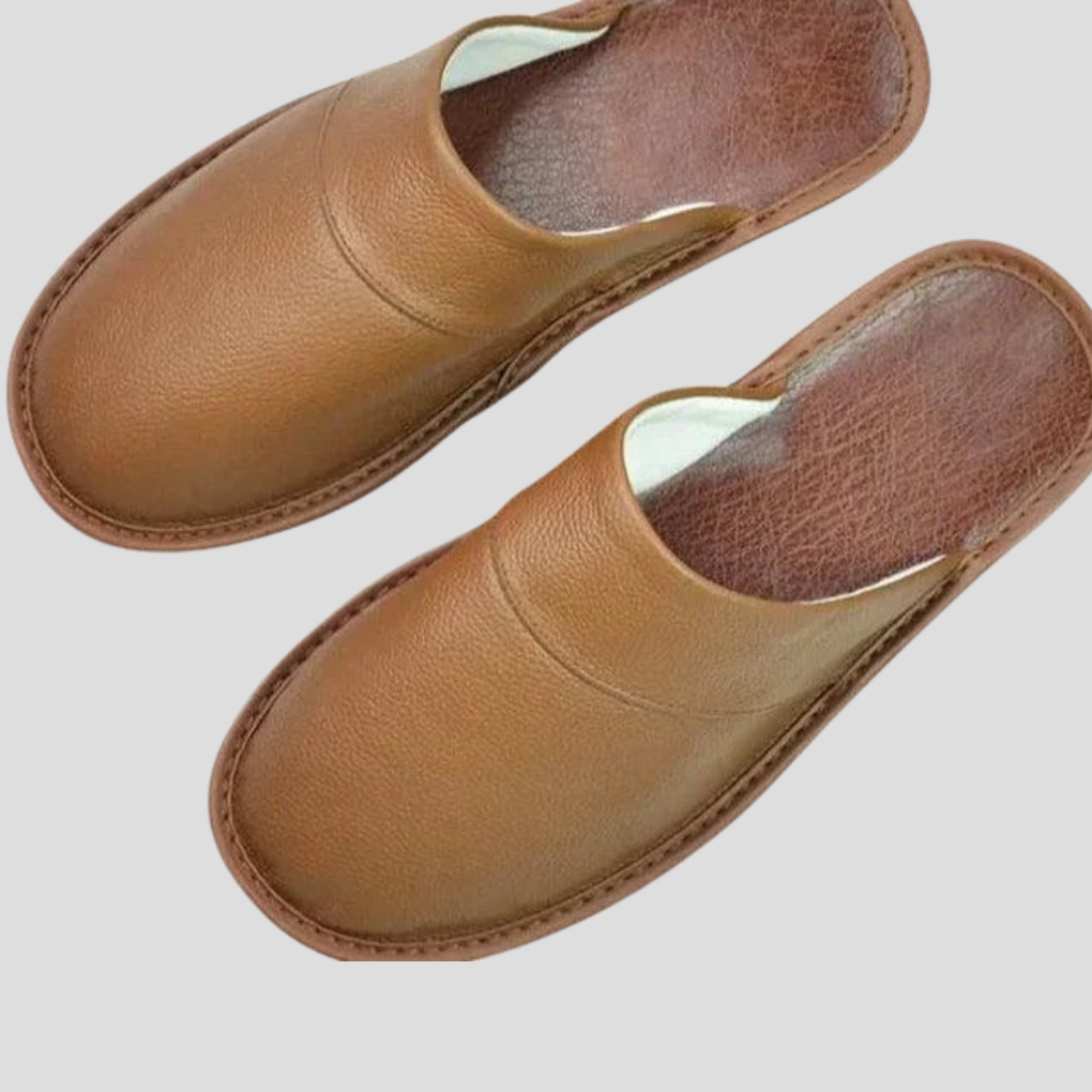 Comfortable men's indoor house shoes, featuring a soft, cozy design and easy slip-on style.