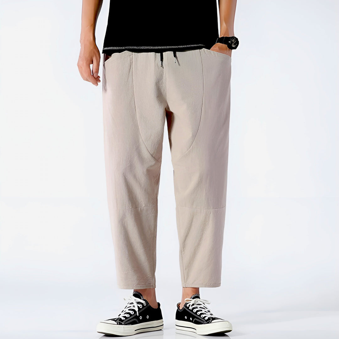 White men's cropped drawstring chino pants, comfortable & stylish summer look.