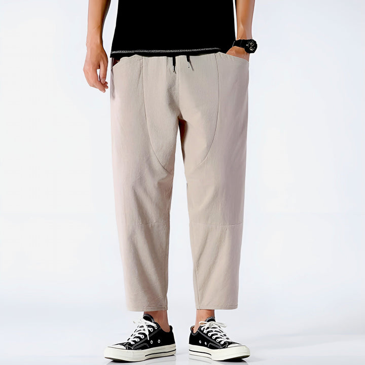 White men's cropped drawstring chino pants, comfortable & stylish summer look.