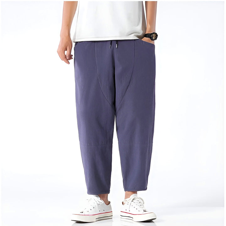 White men's casual cropped drawstring chino pants with relaxed fit.