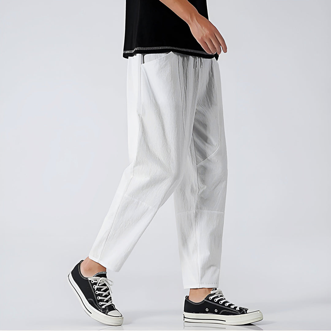 Black men's cropped drawstring pants, stylish leisurewear with comfy fit.