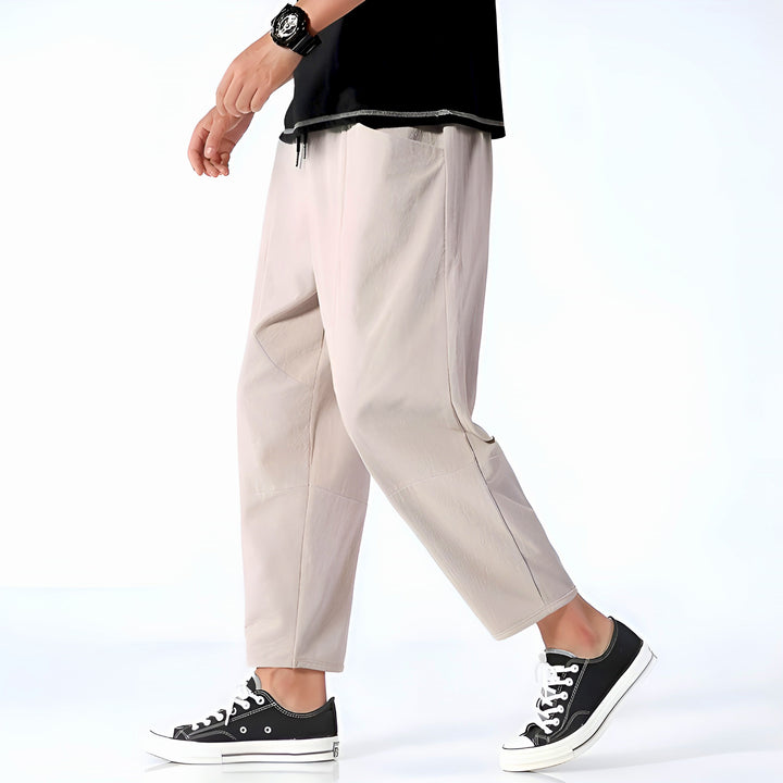 Relaxed fit men's cropped drawstring pants, perfect for casual comfort.