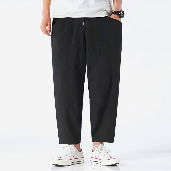 Stylish & versatile men's cropped drawstring chino pants, modern leisurewear.