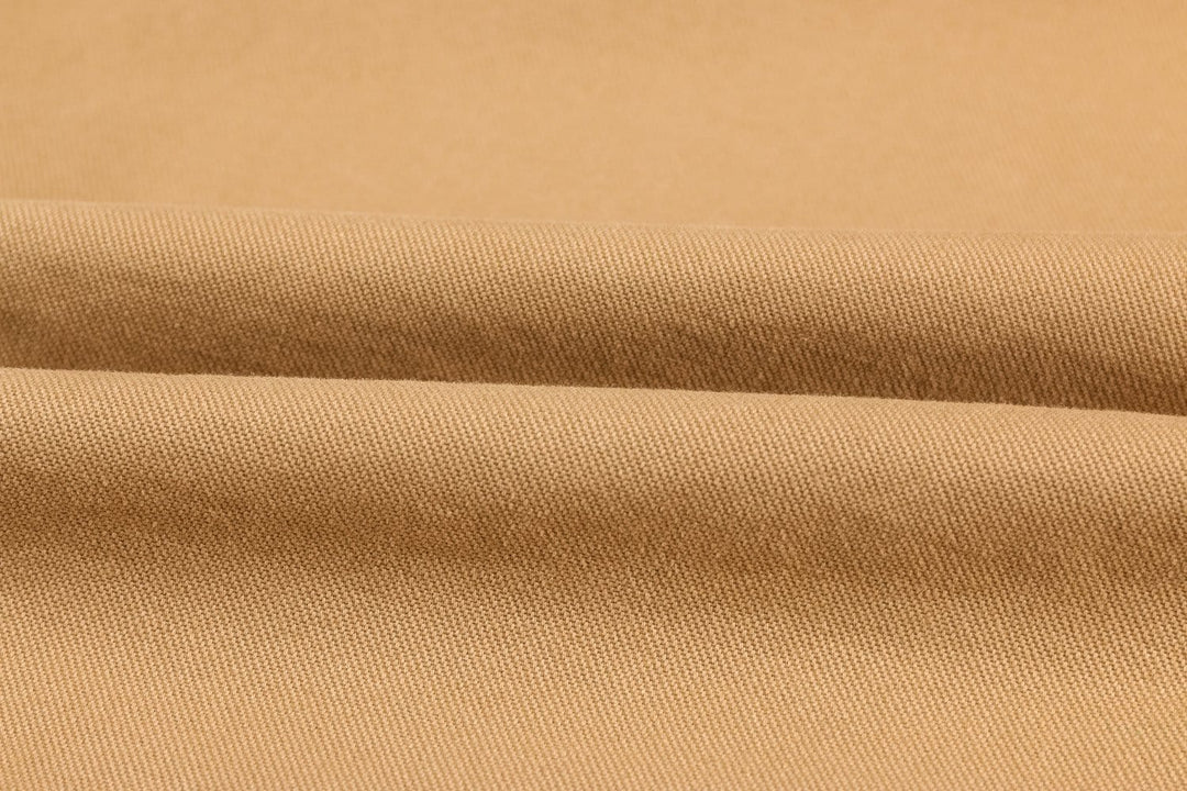 Close-up of the stitching on a men's durable cotton military surplus jacket