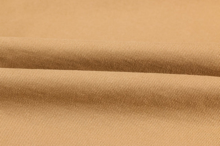 Close-up of the stitching on a men's durable cotton military surplus jacket