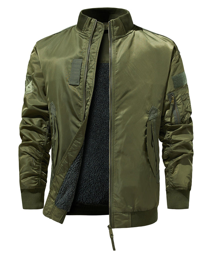 Close-up of the front zipper and ribbed collar on a men's military-style utility bomber jacket.