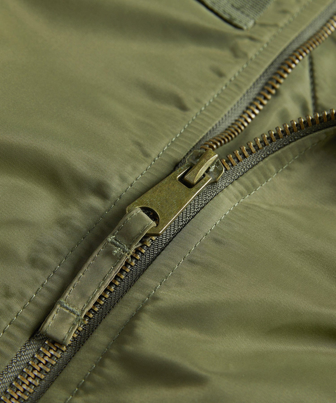 Man posing in a stylish, durable men's bomber jacket, perfect for casual fashion and everyday wear.