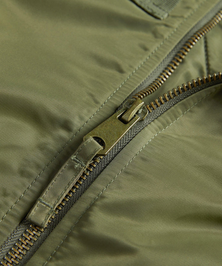Man posing in a stylish, durable men's bomber jacket, perfect for casual fashion and everyday wear.