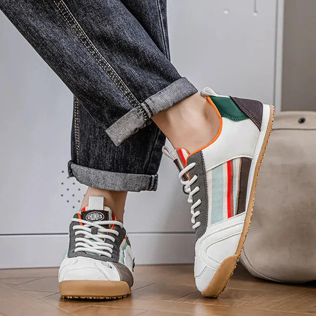 Man walking in performance men's utility sneakers, demonstrating comfort & durability for active everyday use.