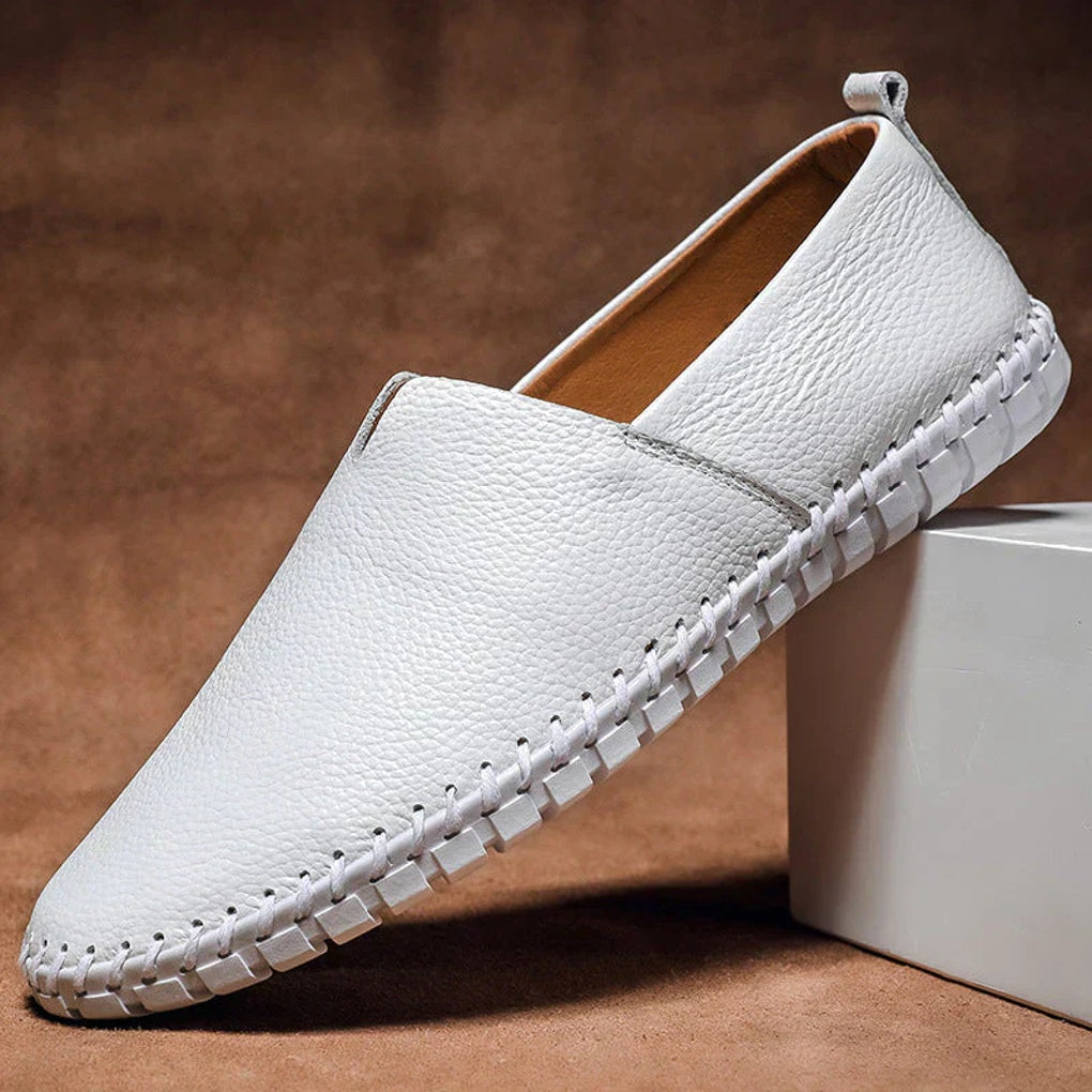 Side view of men's matte slip-on loafers, highlighting minimalist design and quality construction.
