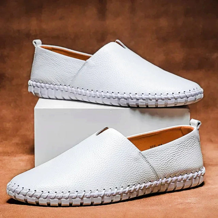 Classic men's slip-on loafers with elegant matte finish, ideal formal or casual footwear.