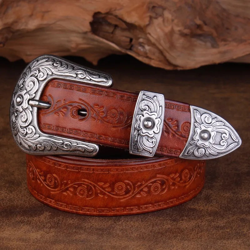 Rustic men's western belt accessory with elaborate engraved patterns and a shiny metal buckle, perfect for everyday wear.