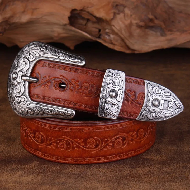 Rustic men's western belt accessory with elaborate engraved patterns and a shiny metal buckle, perfect for everyday wear.
