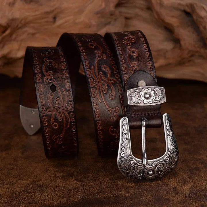 Elegant men's western fashion belt featuring deep engraved floral scrollwork and a sturdy, decorative metal buckle.