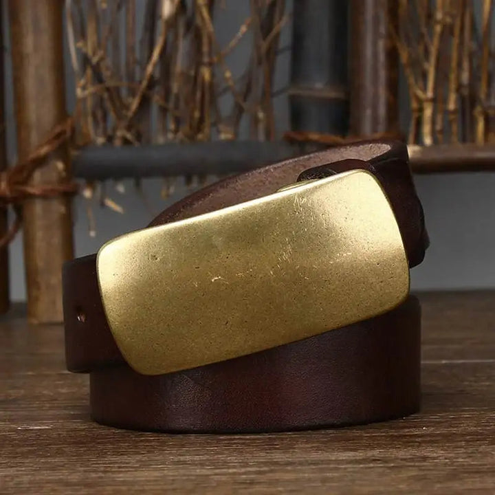 A rugged men's full grain leather belt, built to last. Features a distinctive forged brass buckle.