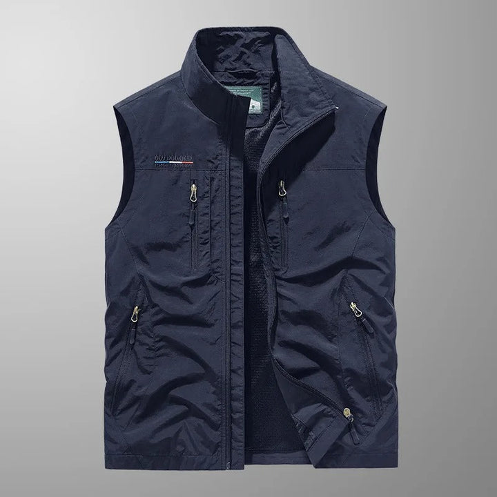 Men's active full zip vest for outdoor adventures. Lightweight layering piece with practical pockets.