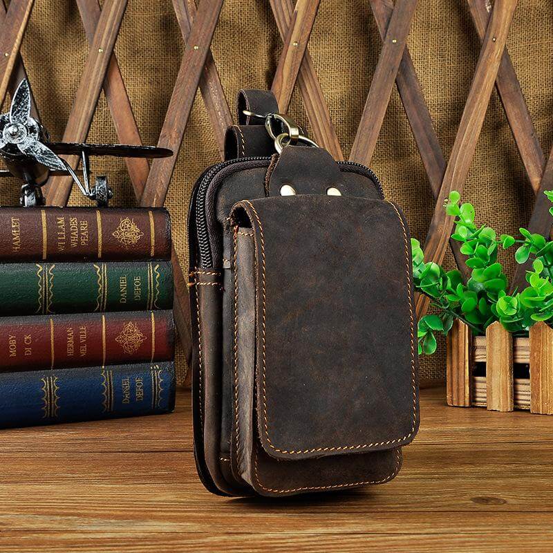 Men's durable leather waist bag, cross-body style for secure, hands-free access.