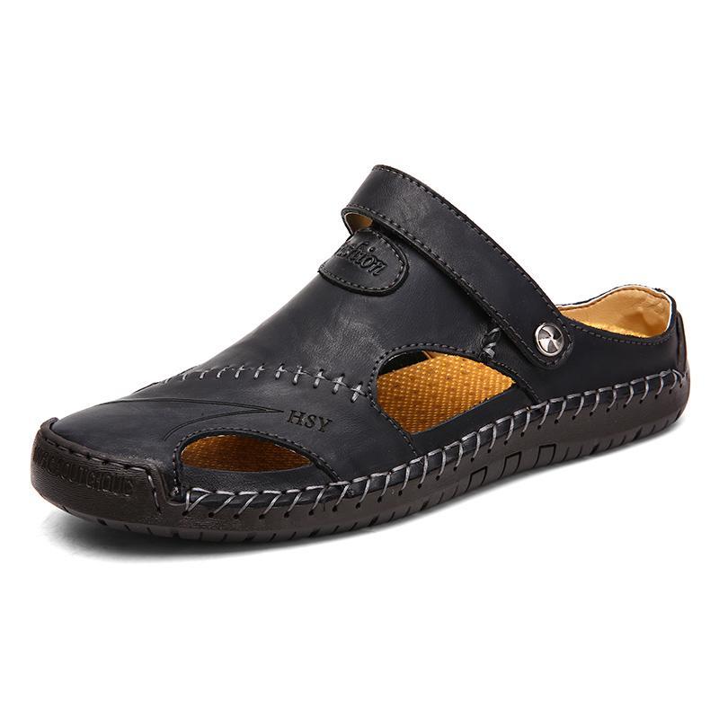 Detail perspective of the hand-stitched seam on men's closed-toe genuine leather sandals.