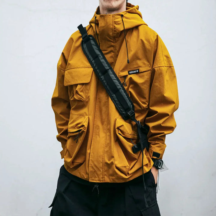 Men's hooded windbreaker jacket with multiple pockets, ideal for spring, fall, travel & casual activewear.