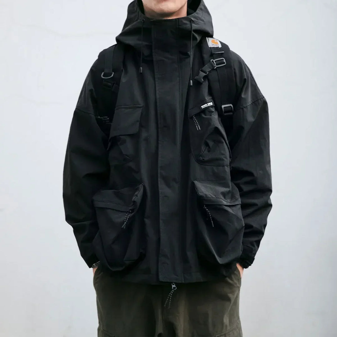 Durable men's hooded windbreaker jacket, featuring a zip-up front & multi pockets, perfect as a spring/fall outerwear.