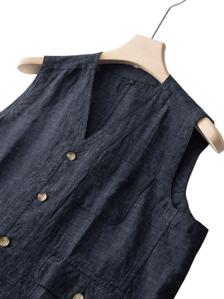 Men's sleeveless indigo linen vest, offering a casual chic and refined summer look.