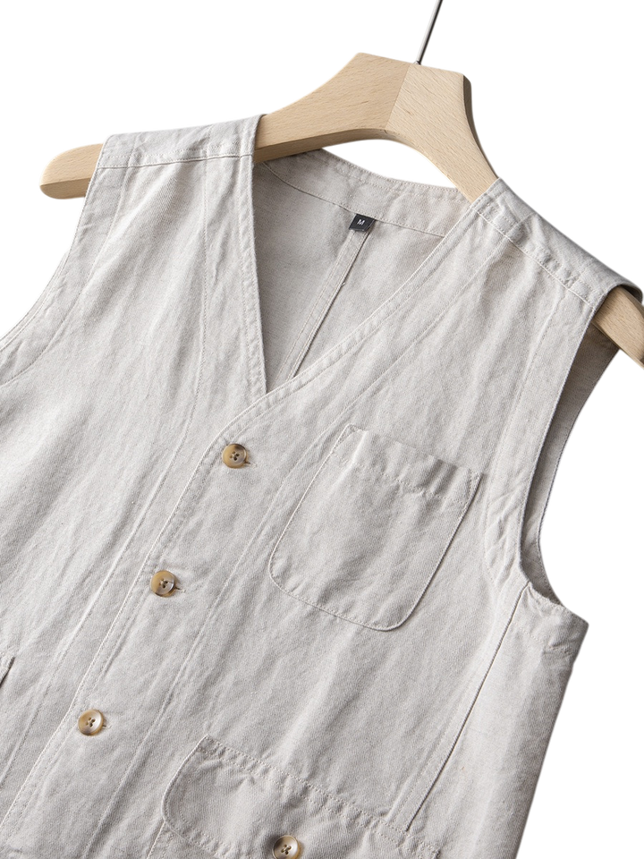 Breathable indigo linen vest for men, tailored fit, perfect for elevated summer comfort.