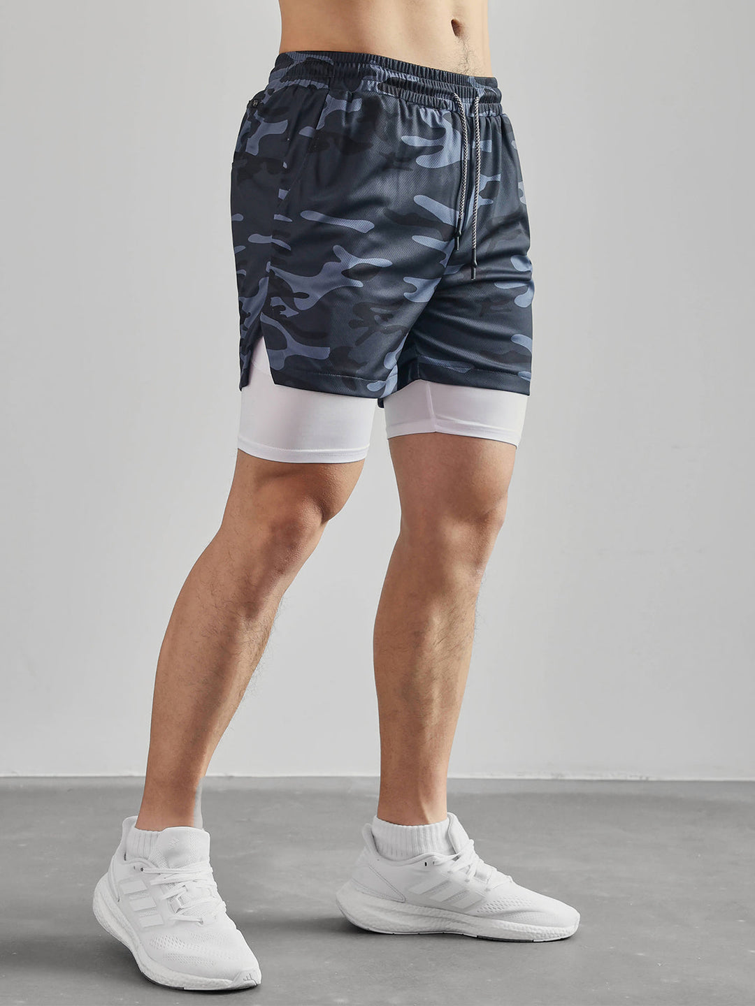 Man jumping, showcasing the flexibility of Men's Kinetic Mesh Lined Athletic Shorts