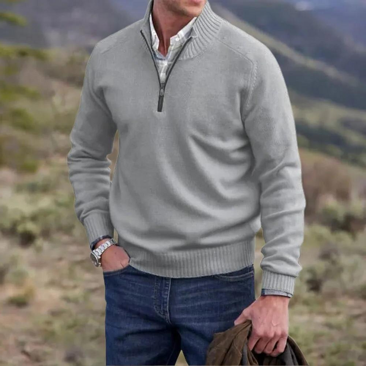 Close-up of a men's knitted half-zip pullover jumper, showcasing the intricate knitwear texture and quality.