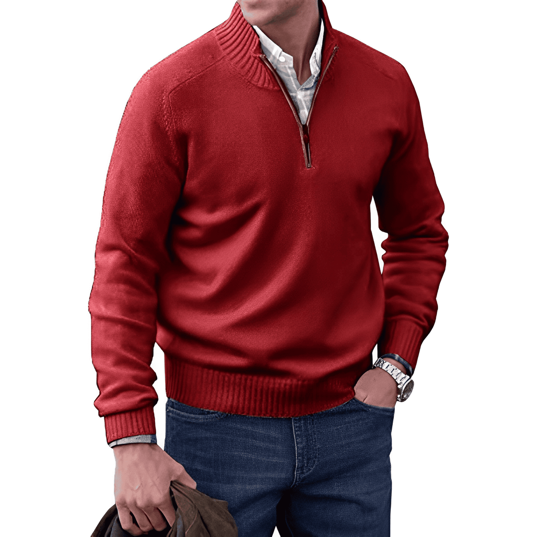 Close-up of the ribbed cuffs and hem of a men's knitted half-zip pullover jumper for a snug fit.