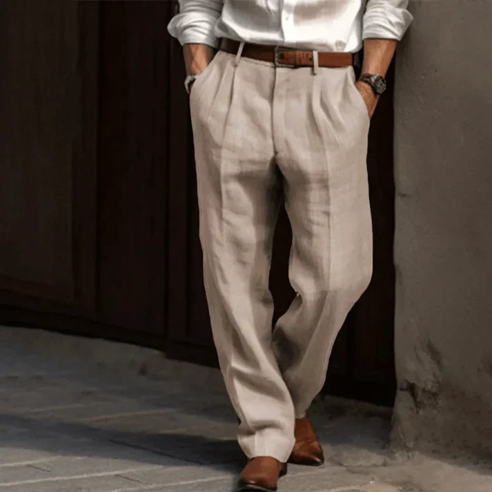 Stylish men's double-pleated trousers in a relaxed fit, great for summer comfort & elegance.