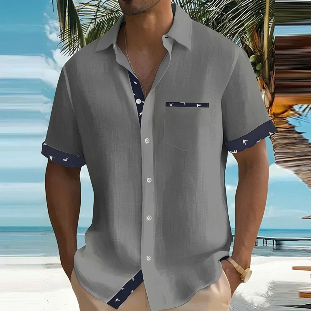 Men's button-up short sleeve shirt. Lightweight fabric offers comfortable style for any casual summer occasion.
