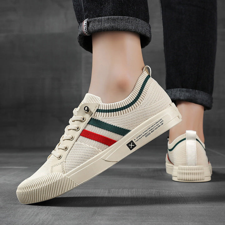 Man walking in comfortable, lightweight men's urban style sneakers. Sandstone & black casual footwear.