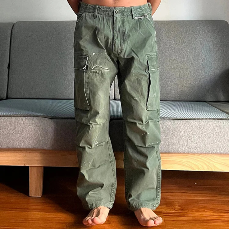 Stylish men's loose fit washed cargo chino pants with utility pockets, great for outdoor wear.