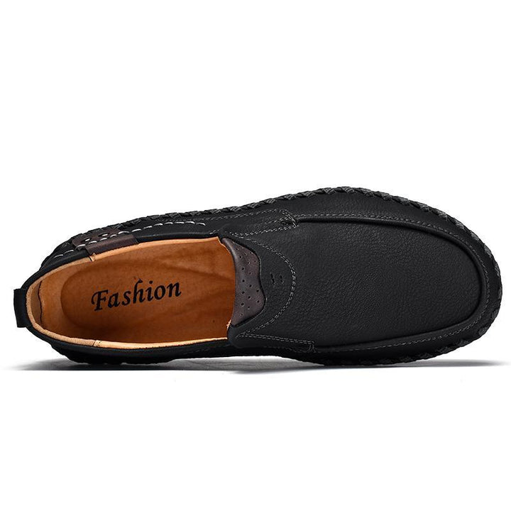 Close-up detail of the smooth texture on men's black leather business casual shoes