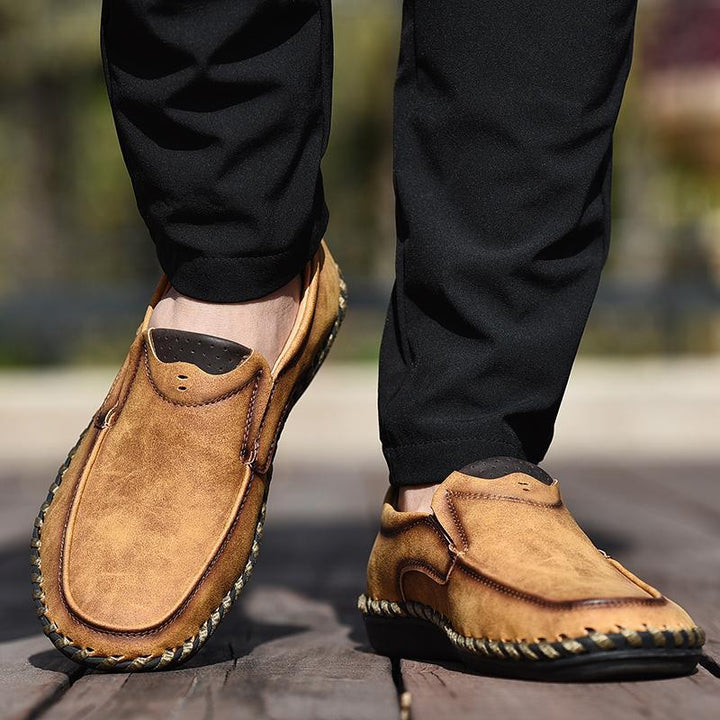 Elegant men's black leather business casual shoes featuring a classic round toe