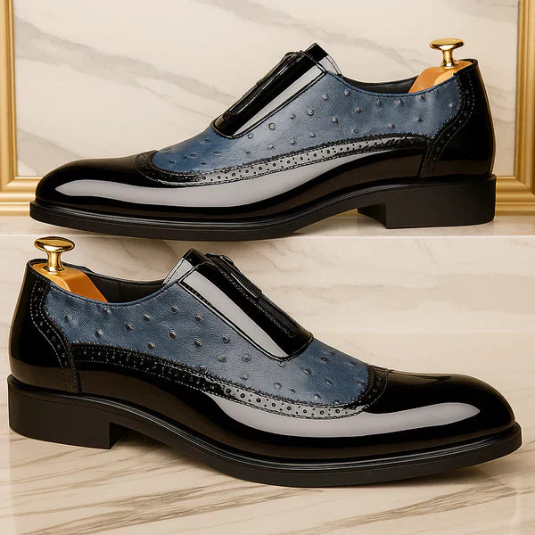 Detail of the side zip on men's modern brown Oxford dress shoes. Sleek, comfortable, and easy-to-wear formal footwear.