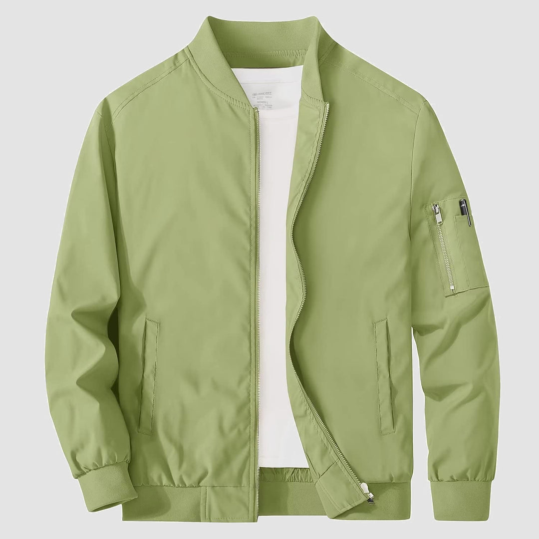 Full-length shot of men's bomber jacket, paired with jeans, showcasing casual versatility