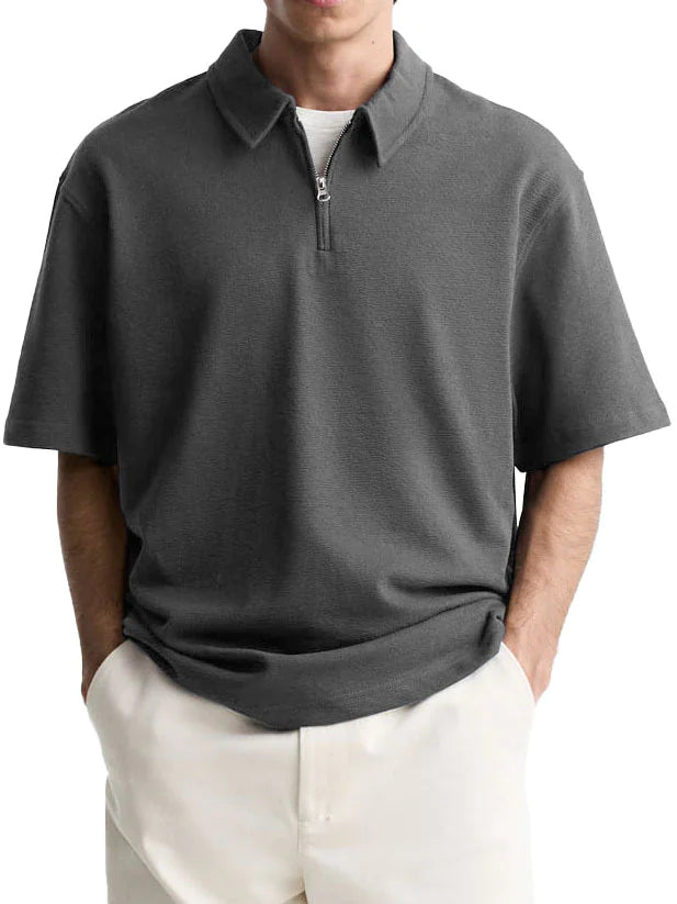 Stylish men's casual half-zip knit shirt in a modern design, perfect for warm weather