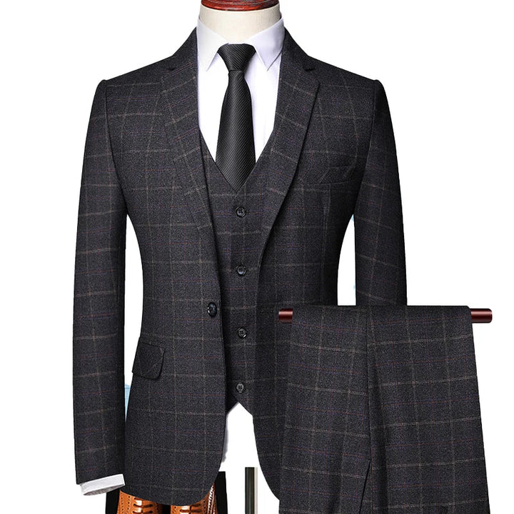 Sharp men's black windowpane plaid 3-piece suit, an elegant choice for formal events and fashion-forward men.