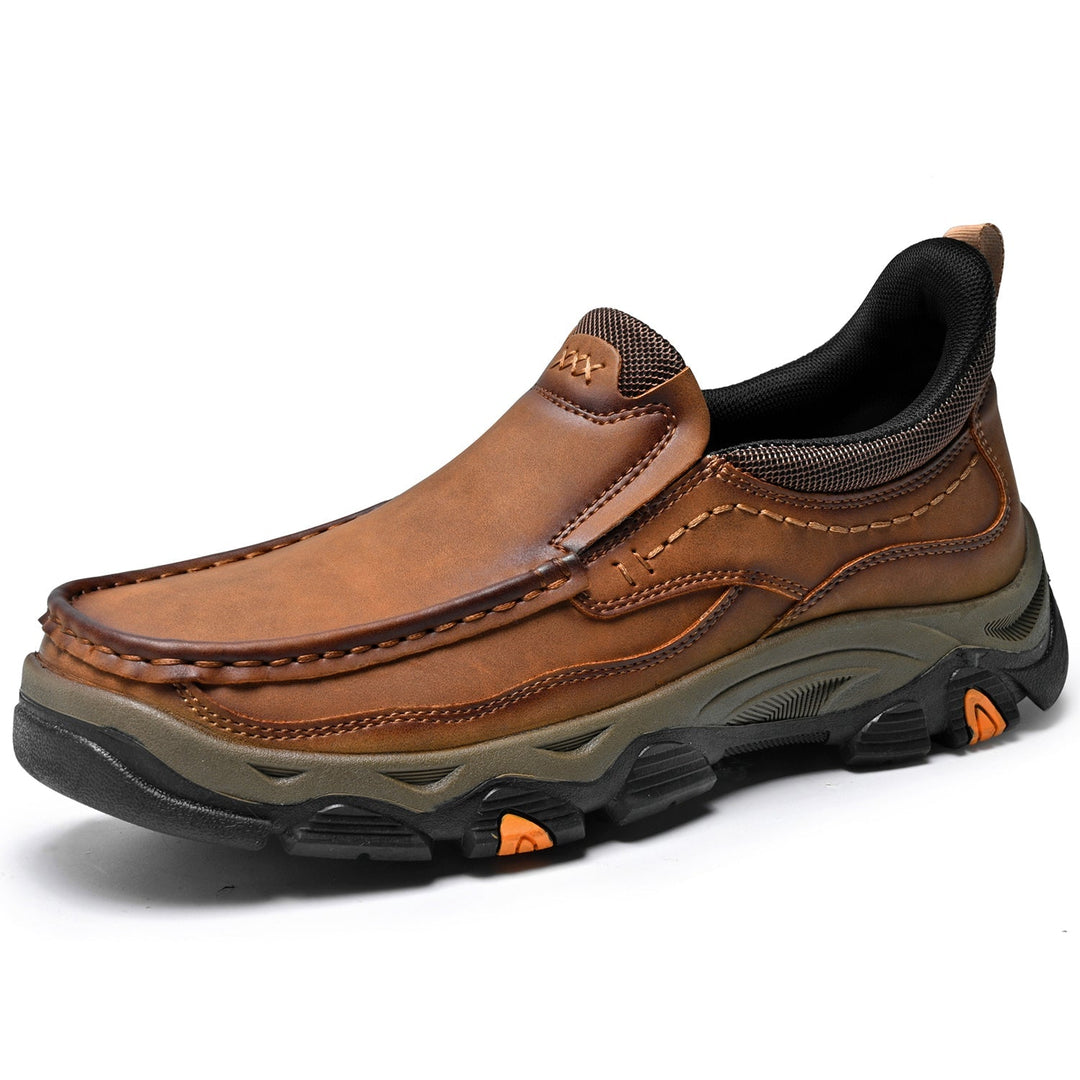 Studio shot of men's slip-on leather walking shoes, highlighting comfort features
