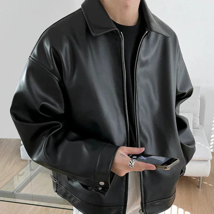 Stylish men's black leather bomber jacket, oversized fit, ideal outerwear for urban fashion.