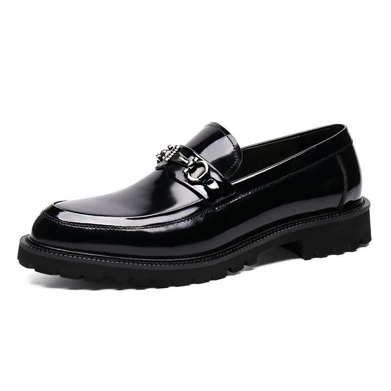 Shiny men's polished black leather loafers with silver metal bit. Elegant classic slip-on formal dress shoes.