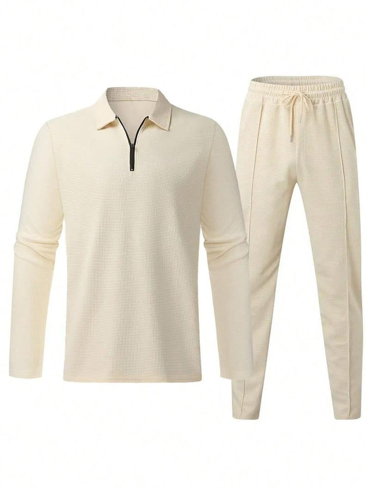 Close-up of a men's premium textured zip-neck top, highlighting the cotton blend and fabric detail.