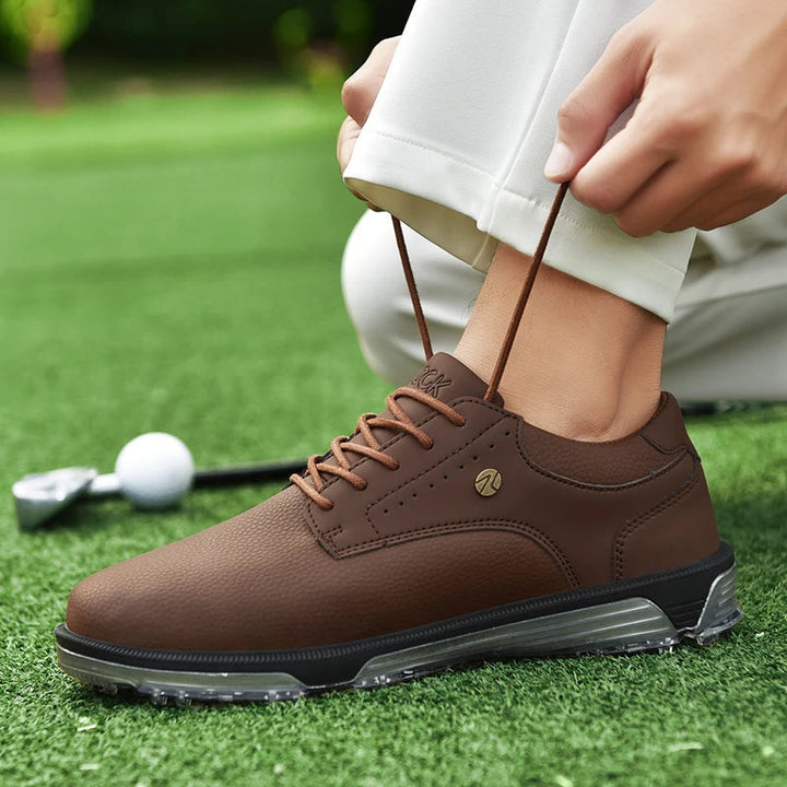 Spiked sole detail of men's Pro Edition leather golf shoes, engineered for superior grip.