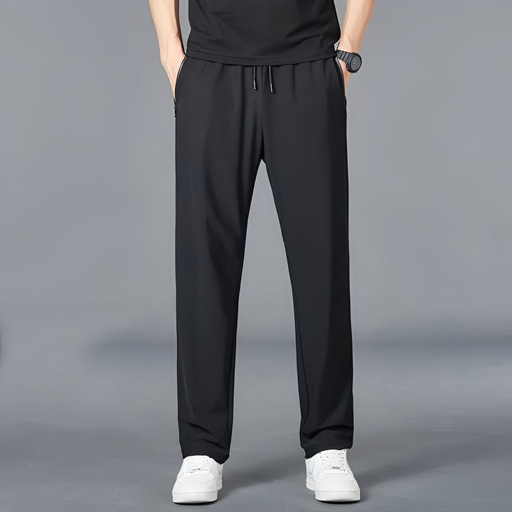 Close-up of durable men's quick-dry stretch fabric hiking pants with cargo pockets for outdoor travel.
