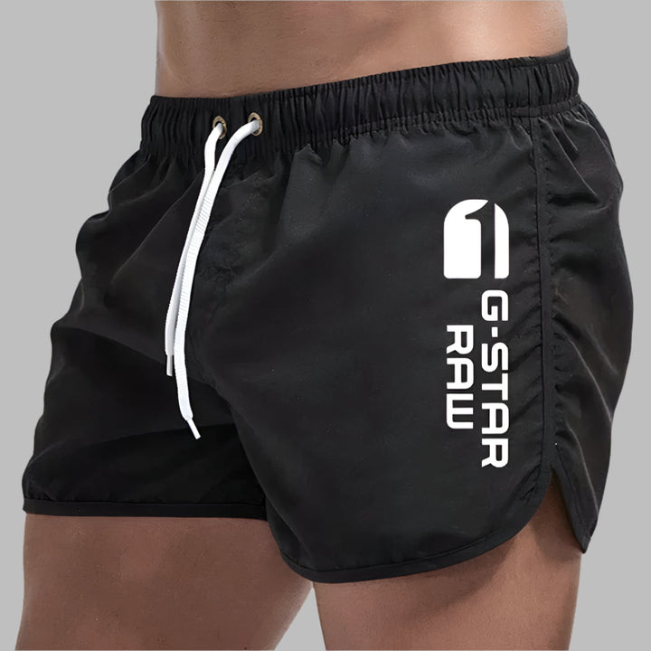 Stylish men's quick dry swimwear for summer beach days or casual pool wear. Durable athletic shorts.