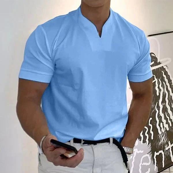 Close-up of the V-neck collar on a men's quick-dry performance t-shirt. Stylish athletic summer activewear.